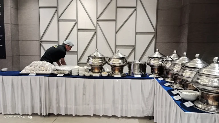 Grand wedding buffet line with silver chafing dishes
