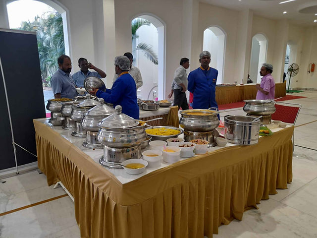 Non-veg buffet corner with multiple chafing dishes