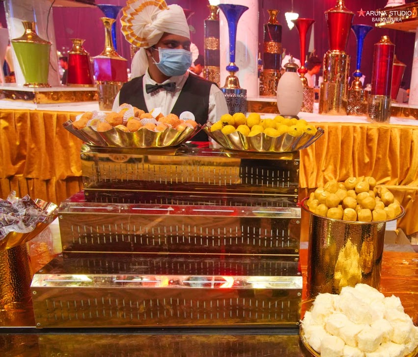 Traditional Indian sweets and dessert counter at a birthday party